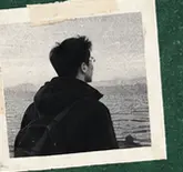 A person looking out over the water